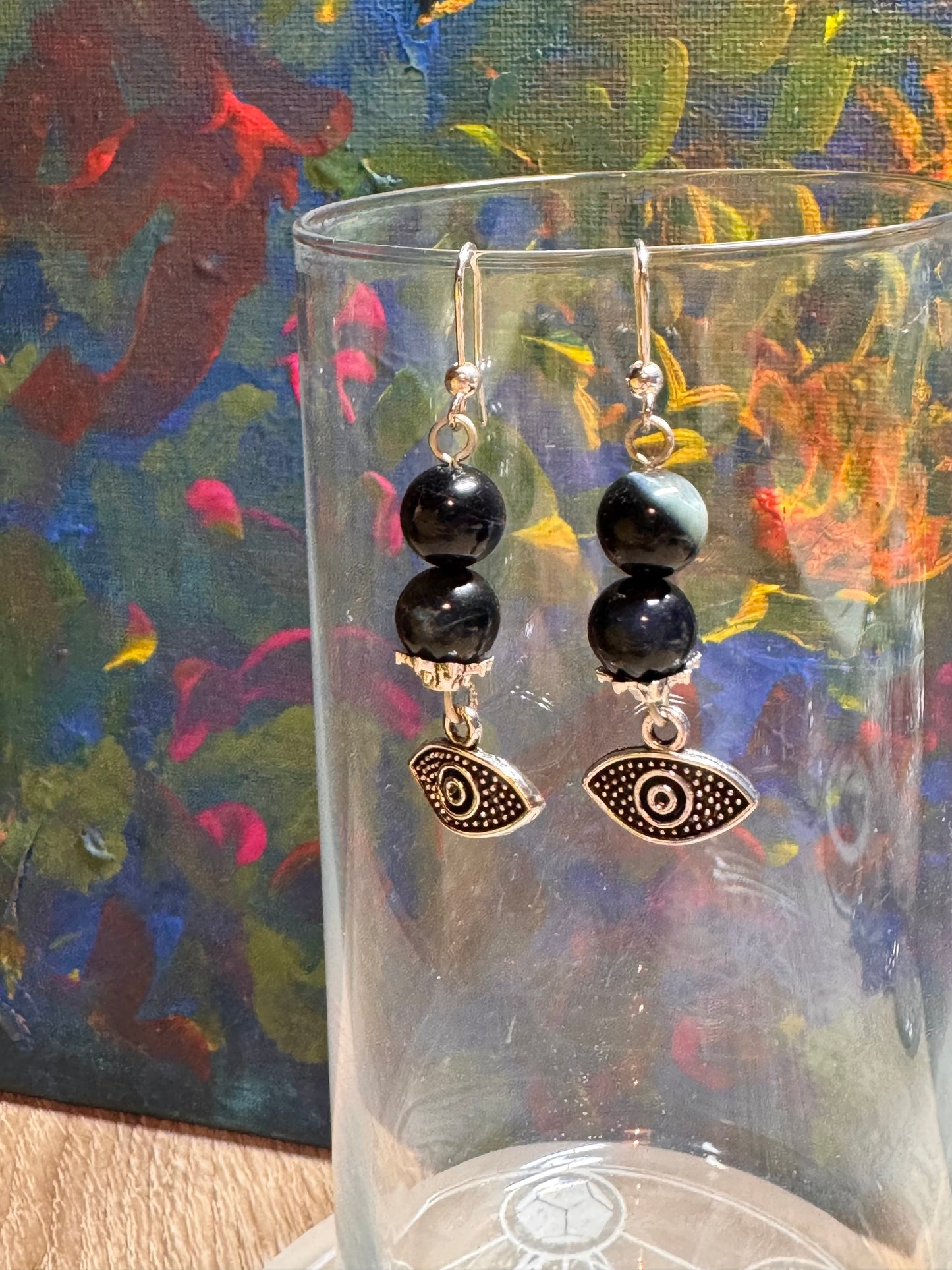 Boucles d’oreilles protection en argent et œil de faucon