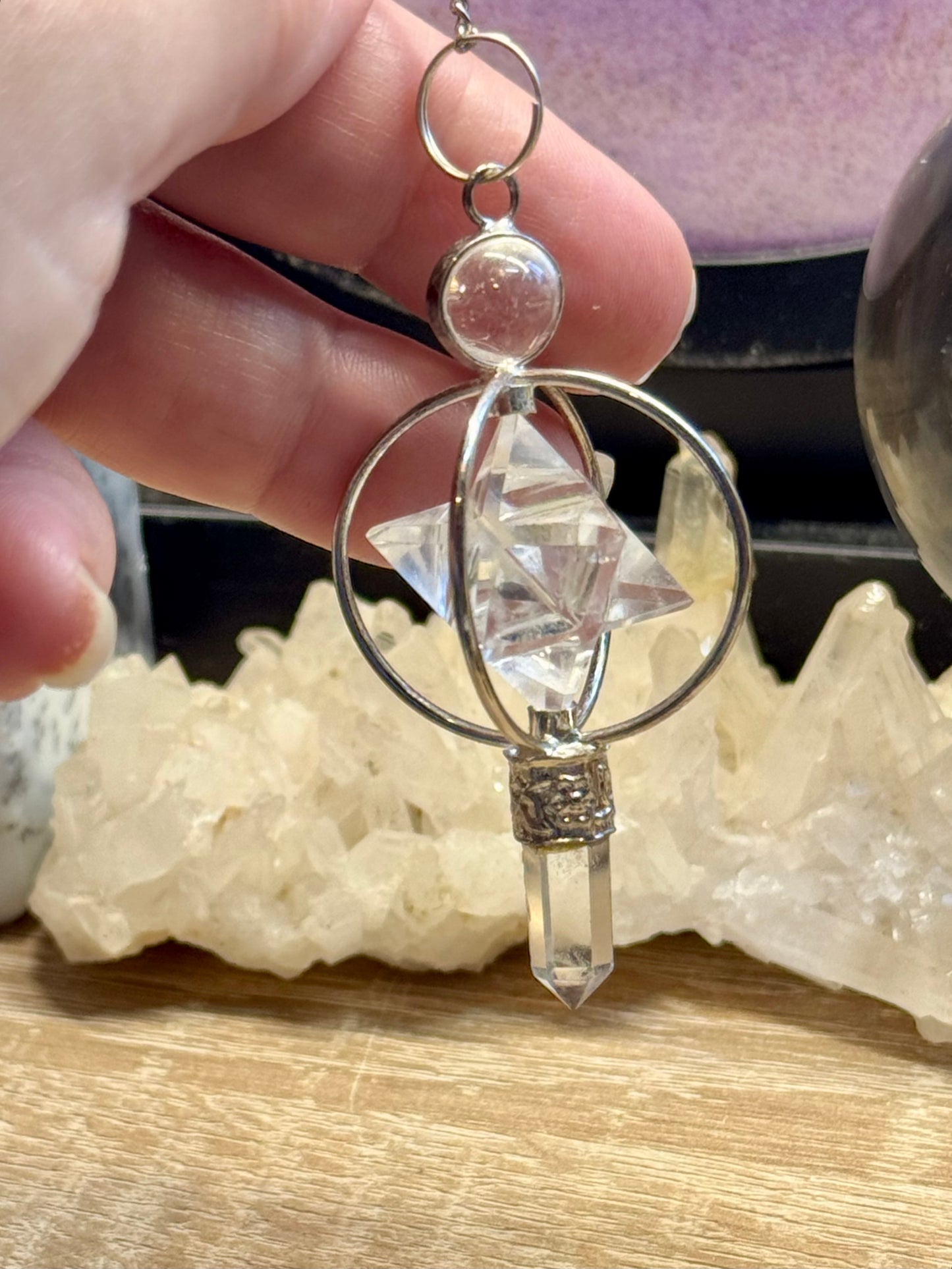 Pendule en cristal de roche Pointe et Merkaba cerclée