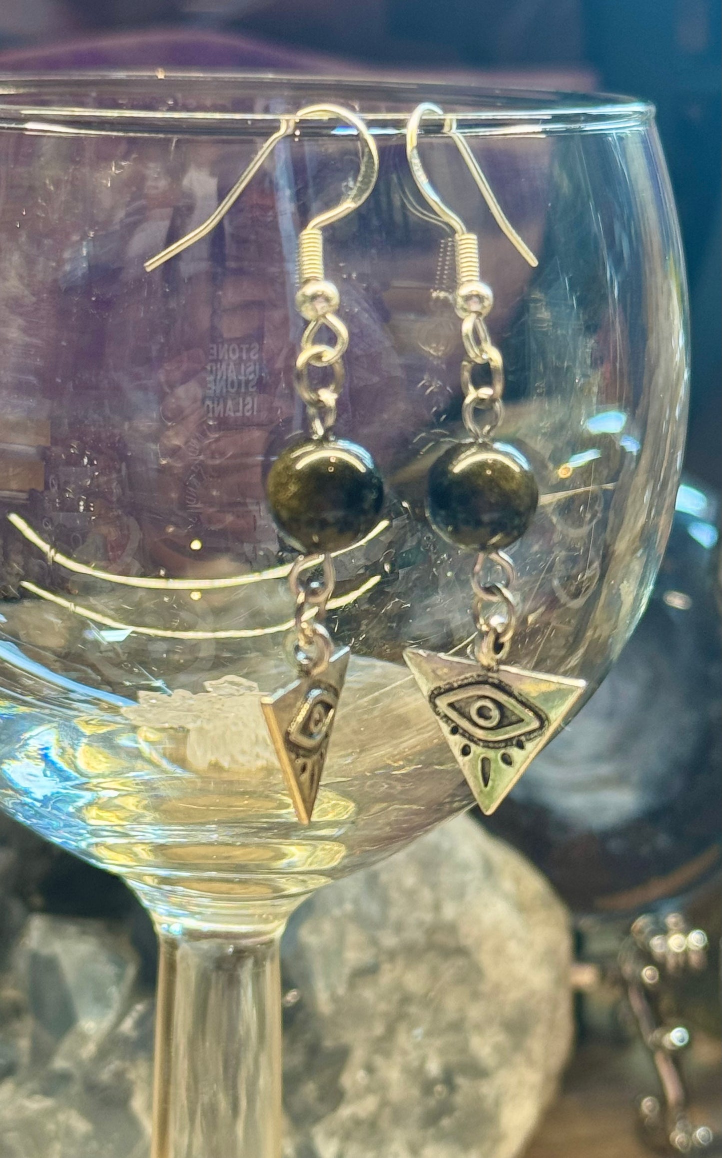 Boucles d’oreilles pendantes Obsidienne Dorée et Oeil d’Horus