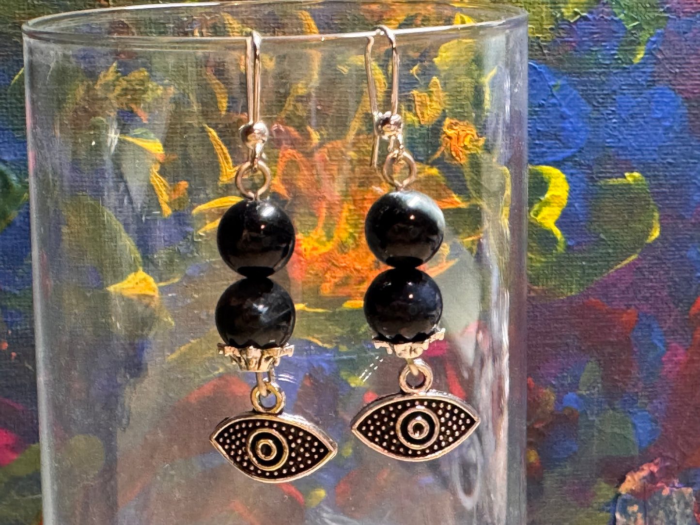 Boucles d’oreilles protection en argent et œil de faucon